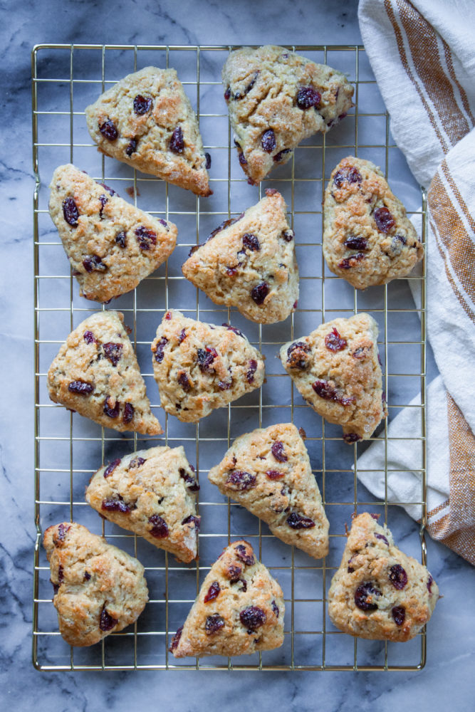 A wire cooling rack filled with eggnog scones.