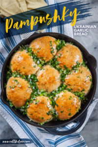 Fresh baked pampushky, Ukrainian garlic bread in a cast iron skillet