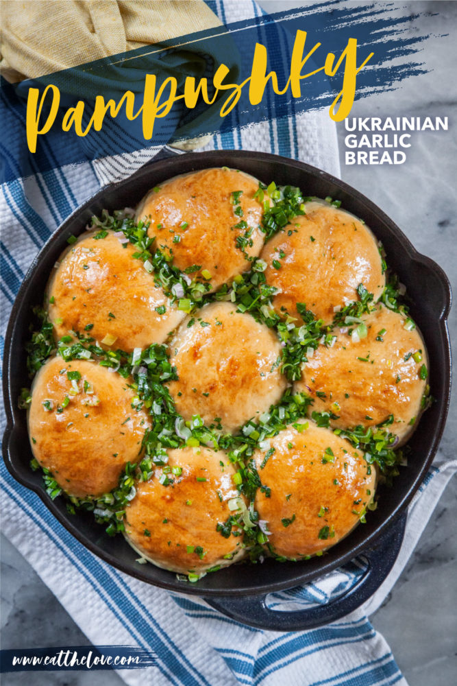 Fresh baked pampushky, Ukrainian garlic bread in a cast iron skillet