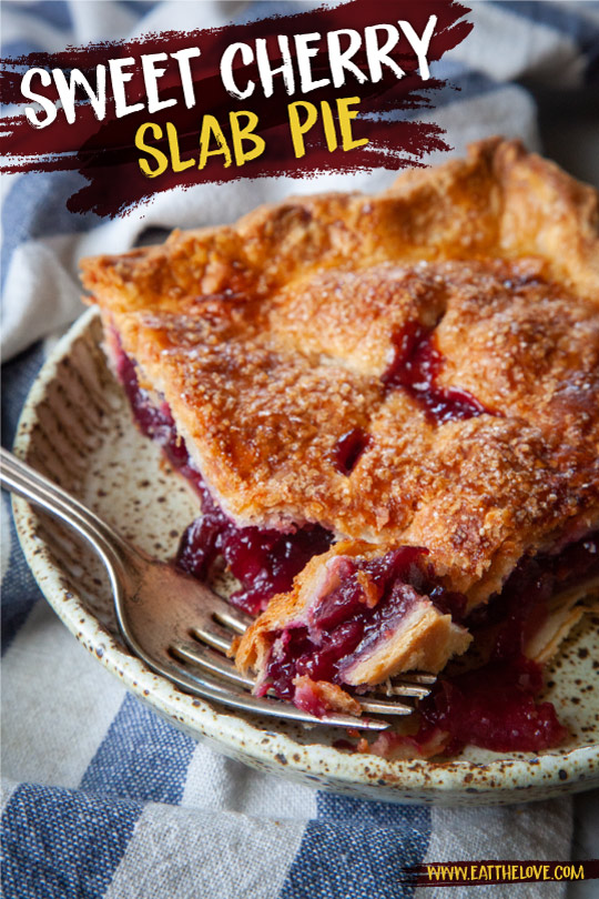 A slice of cherry slab pie on a plate with a fork that has taken a piece out of it.