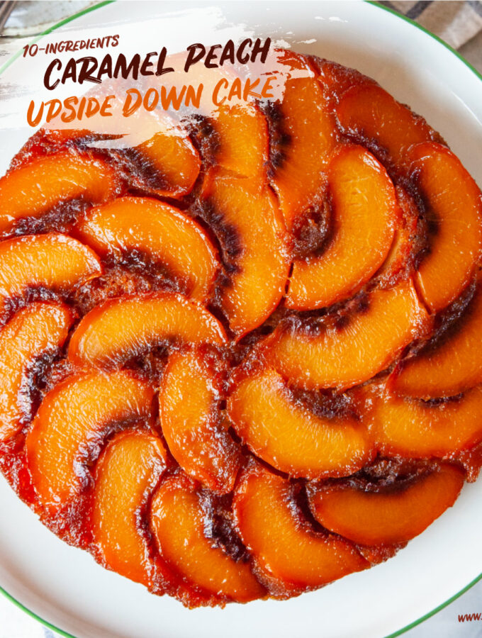 Caramel peach upside down cake on a cake stand.