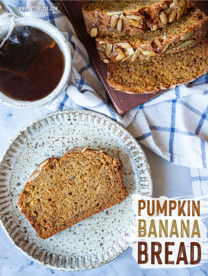 A slice of pumpkin banana bread on a plate, with a mug of tea and the remaining pumpkin banana bread sliced on a cutting board next to the plate.