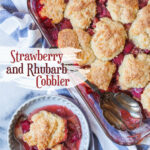 A bowl with a serving of strawberry rhubarb cobbler in it, and the remaining cobbler in a glass casserole dish next to the bowl.