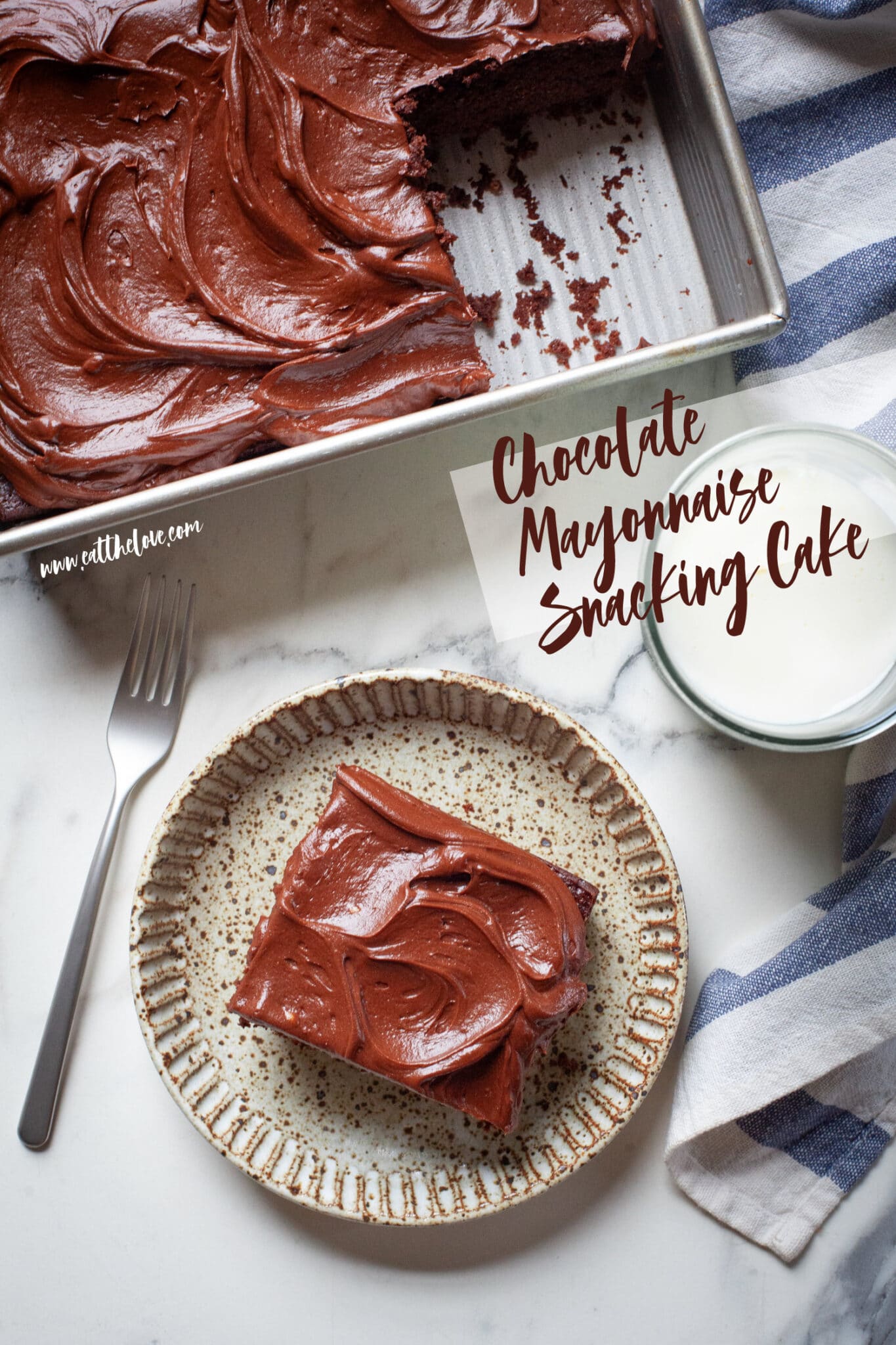 A slice of chocolate mayonnaise cake on a plate, with the remaining cake in a pan next to it.